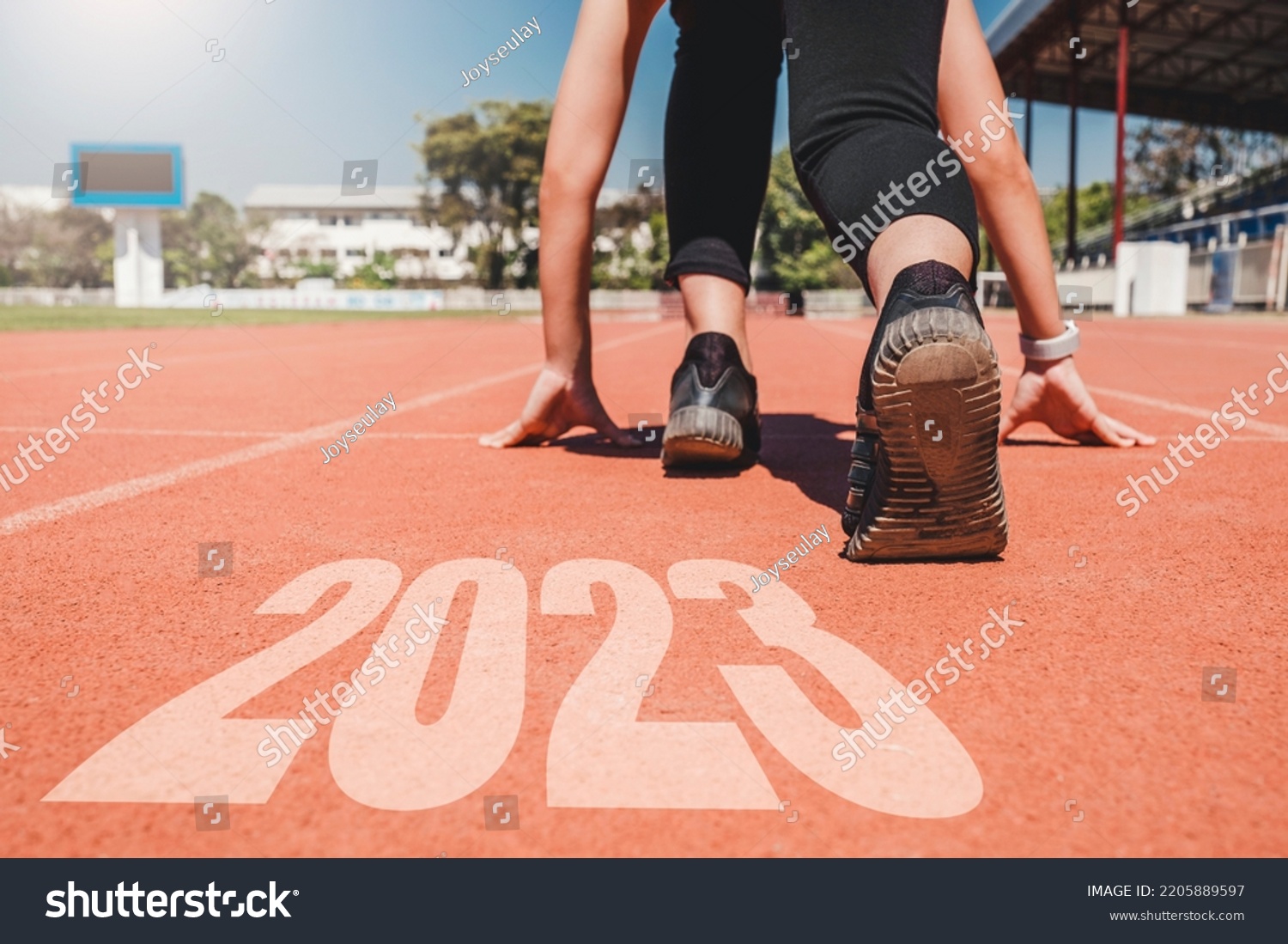 2023 Newyear , Athlete Woman starting on line for start running with number 2020 Start to new year. #2205889597