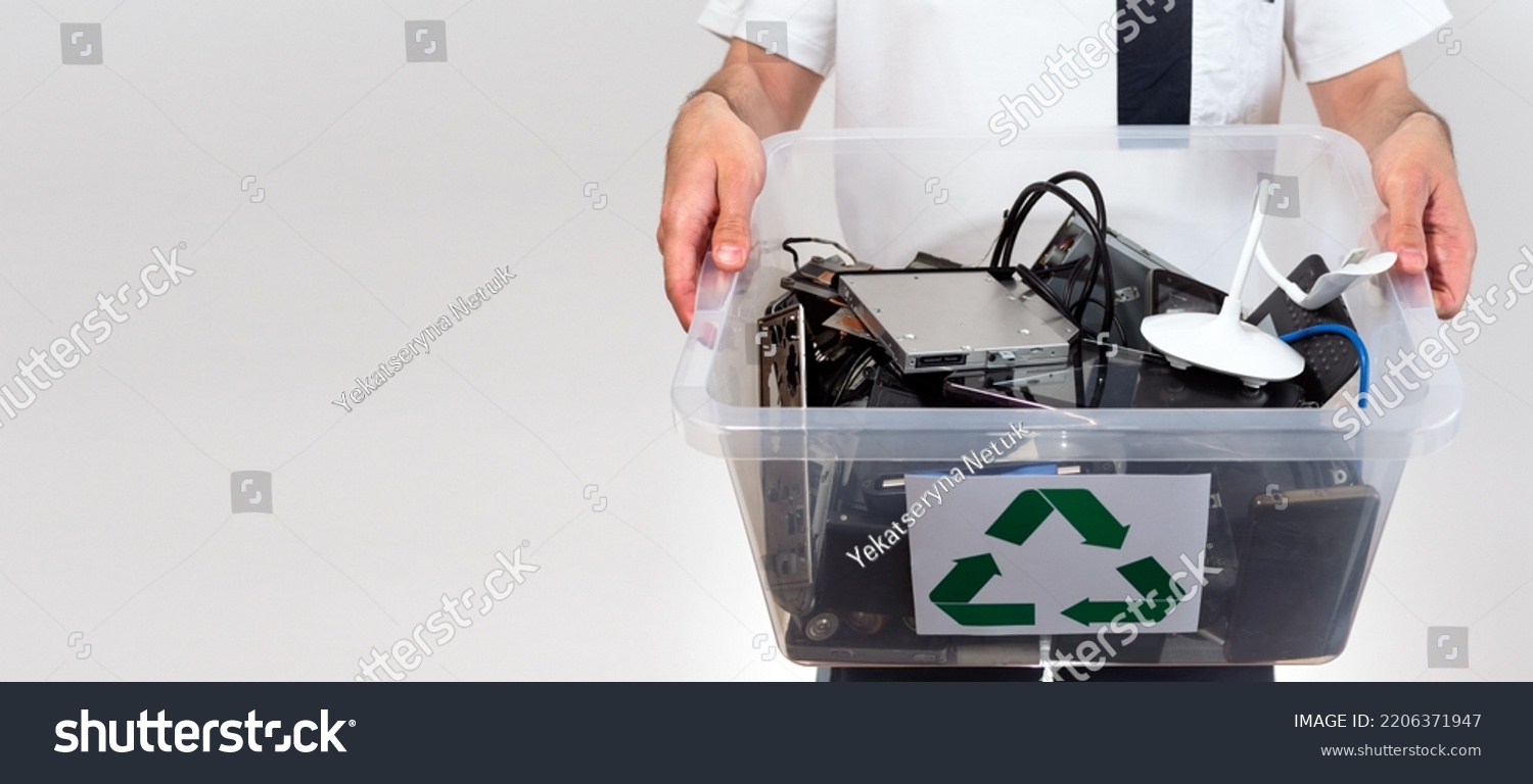 Hazardous E-Waste Recycling. Household electrical and scrapped electronic devices in recycle box. Sorting, disposing and recycling. Waste Electrical and Electronic Equipment. banner with copy space #2206371947