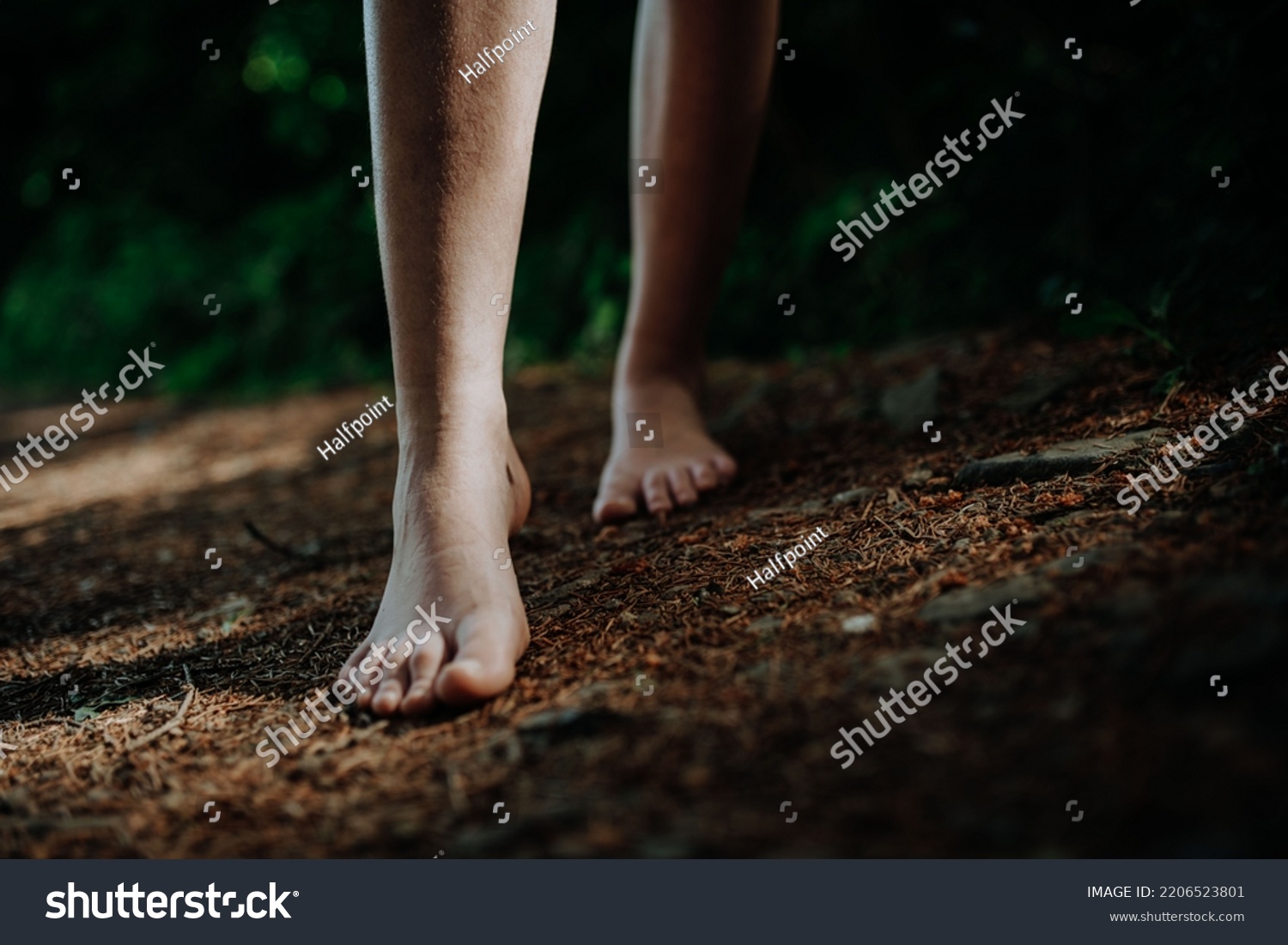 Close-up of barefoot legs walking in nature. Concept of healthy feet. #2206523801