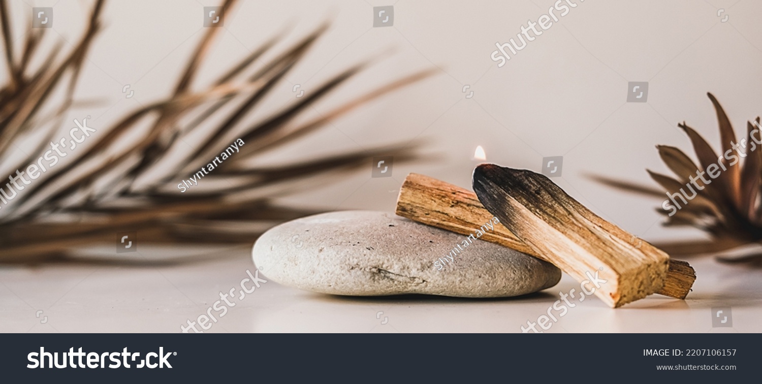 Palo Santo sticks on a light background.Aromatherapy religious rituals meditation.Wellness with aromatherapy and the occult.Healing incense Palo Santo.Organic incense of the holy ritual tree.Ibiokai #2207106157