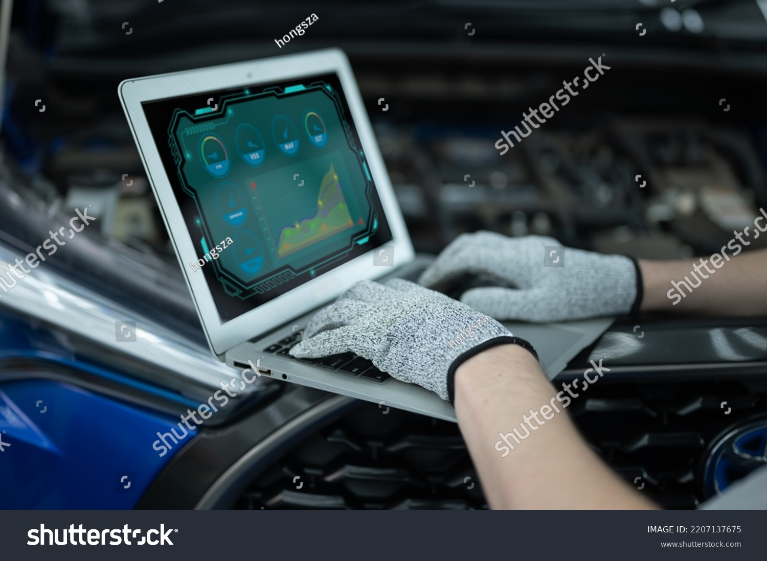 Mechanic Asian Arab man close up using laptop computer and diagnostic software to tuning fixing repairing car engine automobile vehicle parts using tools equipment in workshop garage support services #2207137675