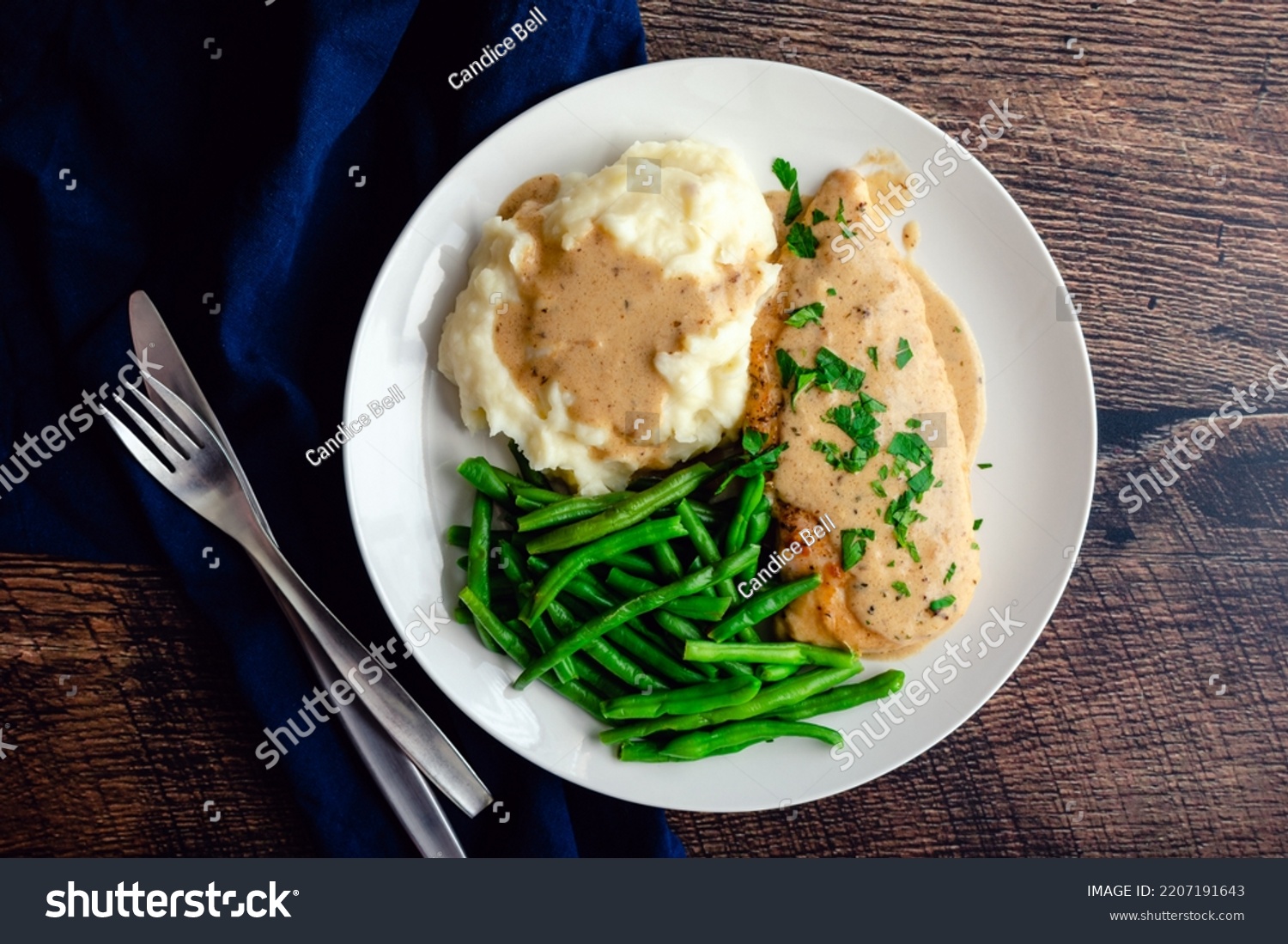 Chicken Breast Served with Green Beans, Mashed Potatoes, and Garlic Gravy: Chicken cutlet topped with creamy garlic sauce served with vegetables #2207191643