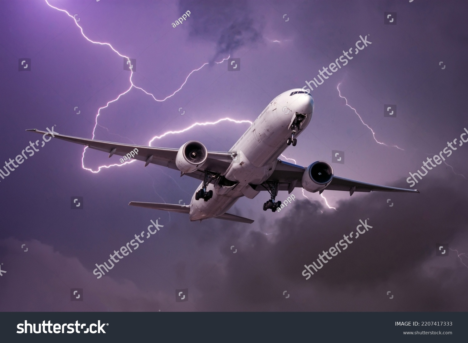 Landing airliner during a strong wind in a storm against the backdrop of a flash of lightning #2207417333