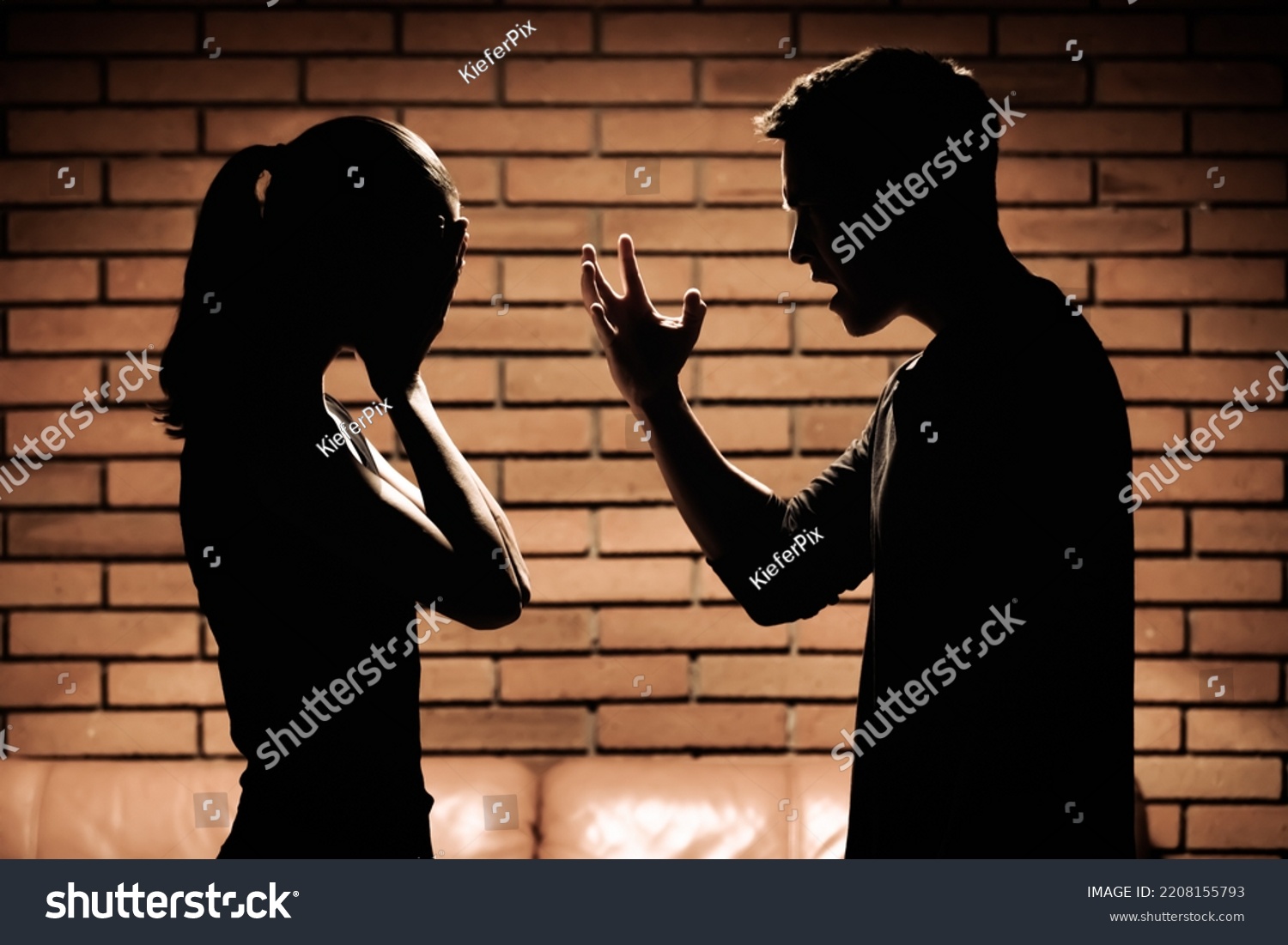 Man screaming verbal insults to woman. Domestic abuse and bad relationship concept.  #2208155793