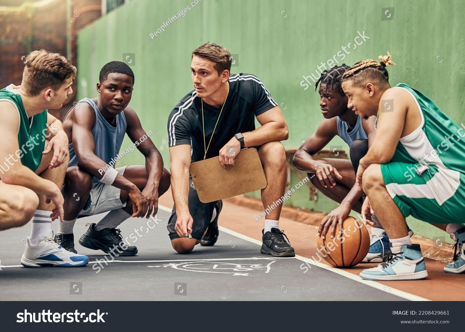 Basketball strategy, team sports and coach talking to USA sport group about coaching for game on court. Young athlete students in communication about idea during training for professional competition #2208429661