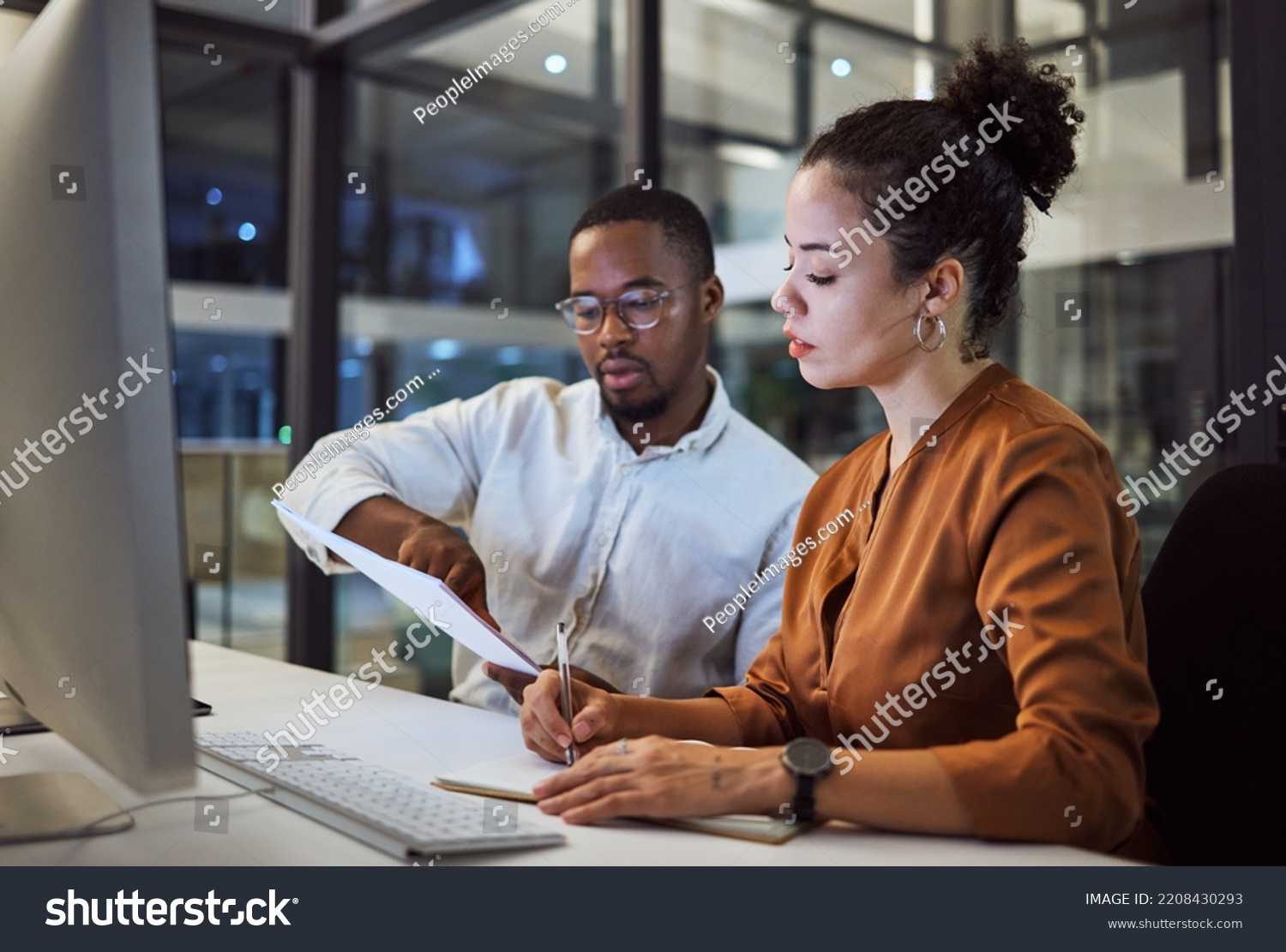 Teamwork in New York office at night, business document reading together and professional accounting report. Black man with financial audit, showing latino woman figures and employee collaboration #2208430293