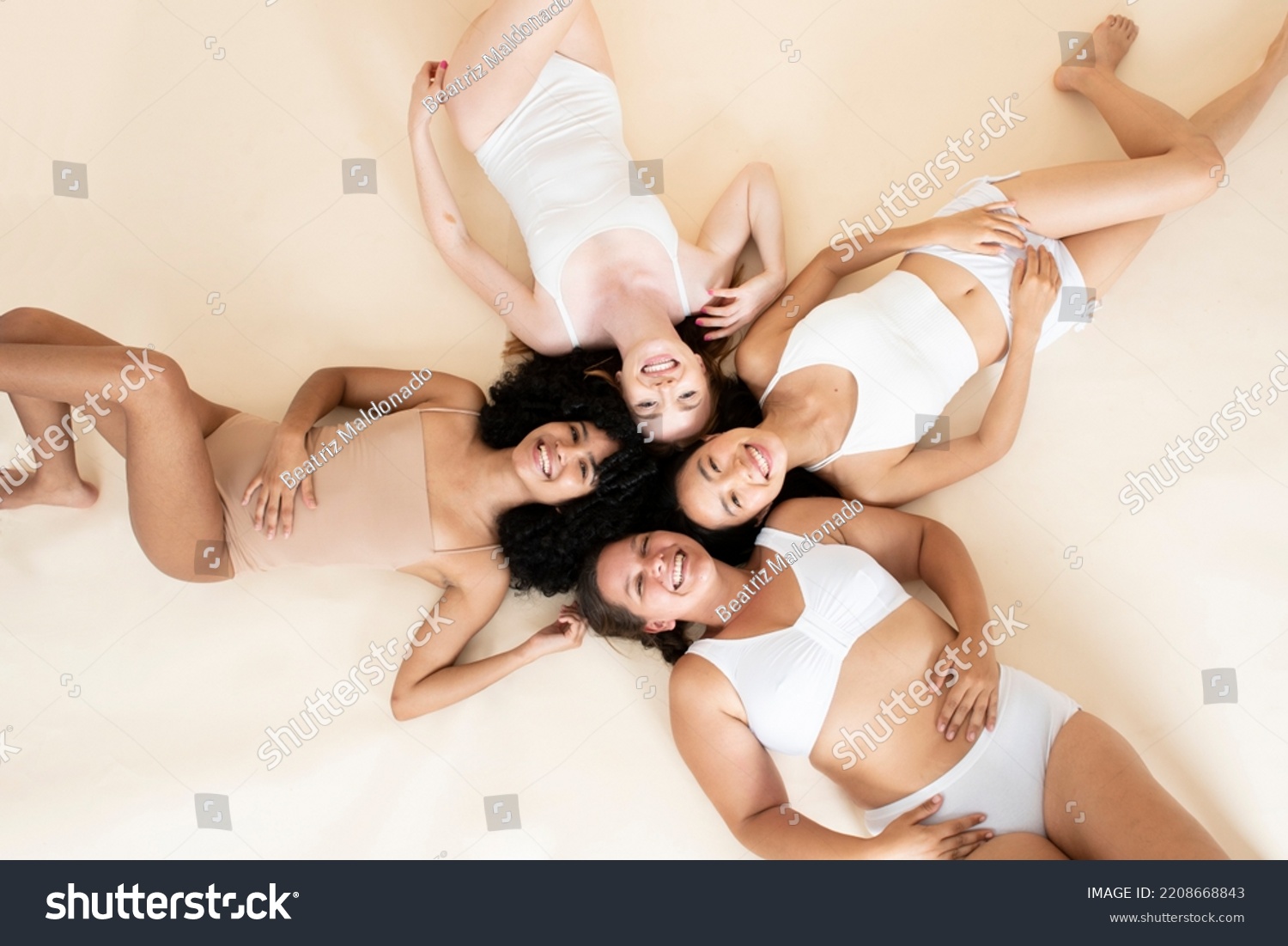 group of young girls of different sizes and races. Smiling together. Beautiful bodies. Natural beauty. Self-love. #2208668843