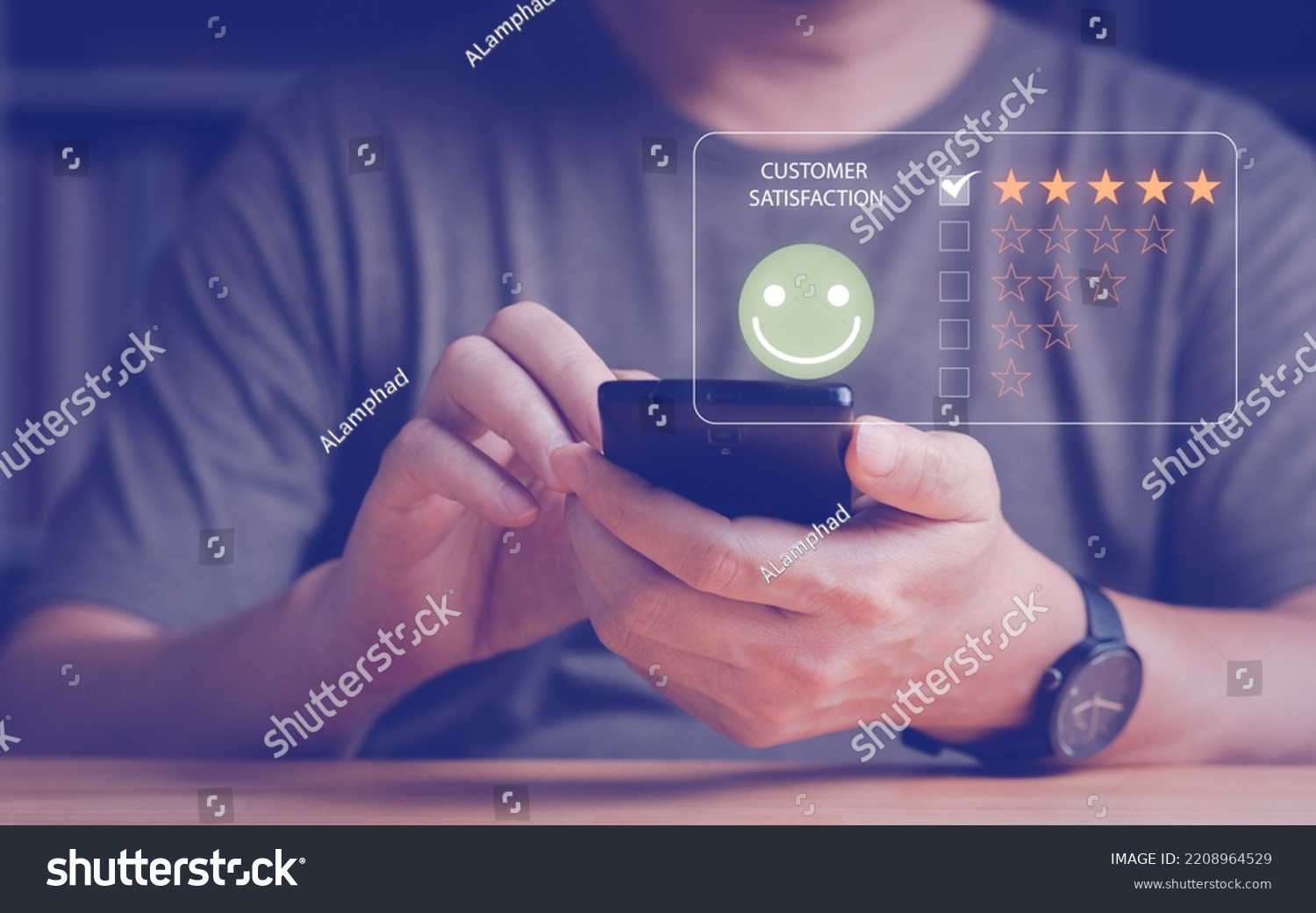 Man's hand give the customer satisfaction feedback with smart phone, review and rating with five gold stars and smiley face. Customer satisfaction feedback and survey concept. #2208964529