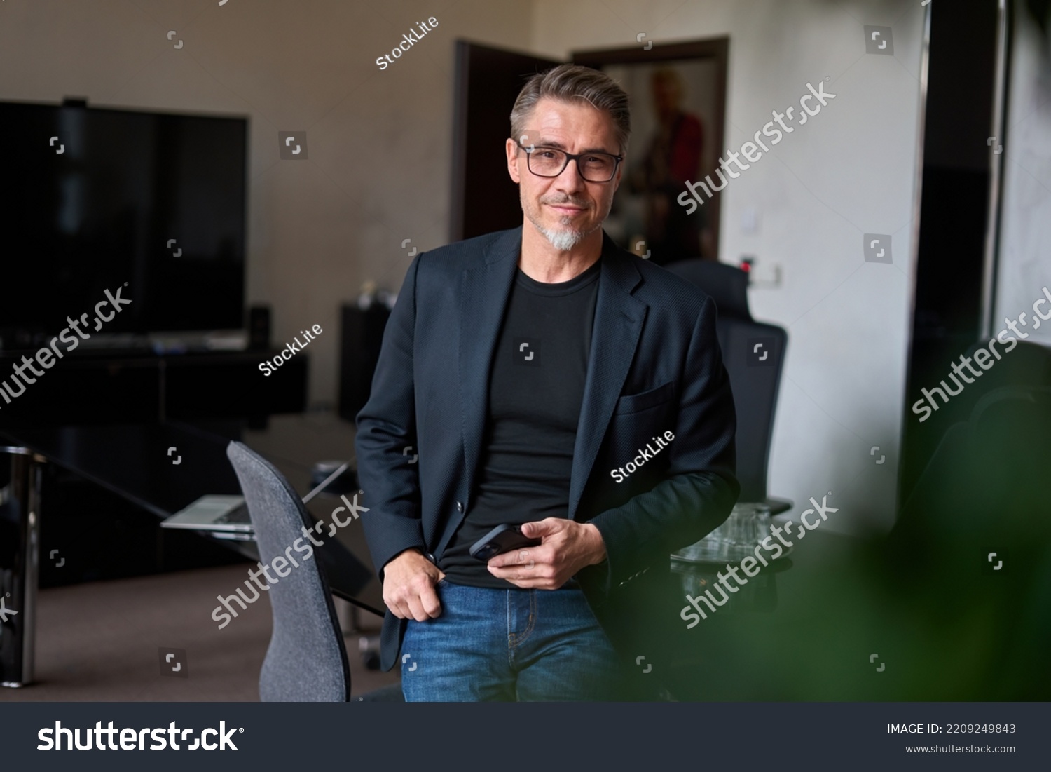 Portrait of confident businessman in business casual. Happy middle aged, mid adult, mature age man smiling. Entrepreneur in modern office. #2209249843
