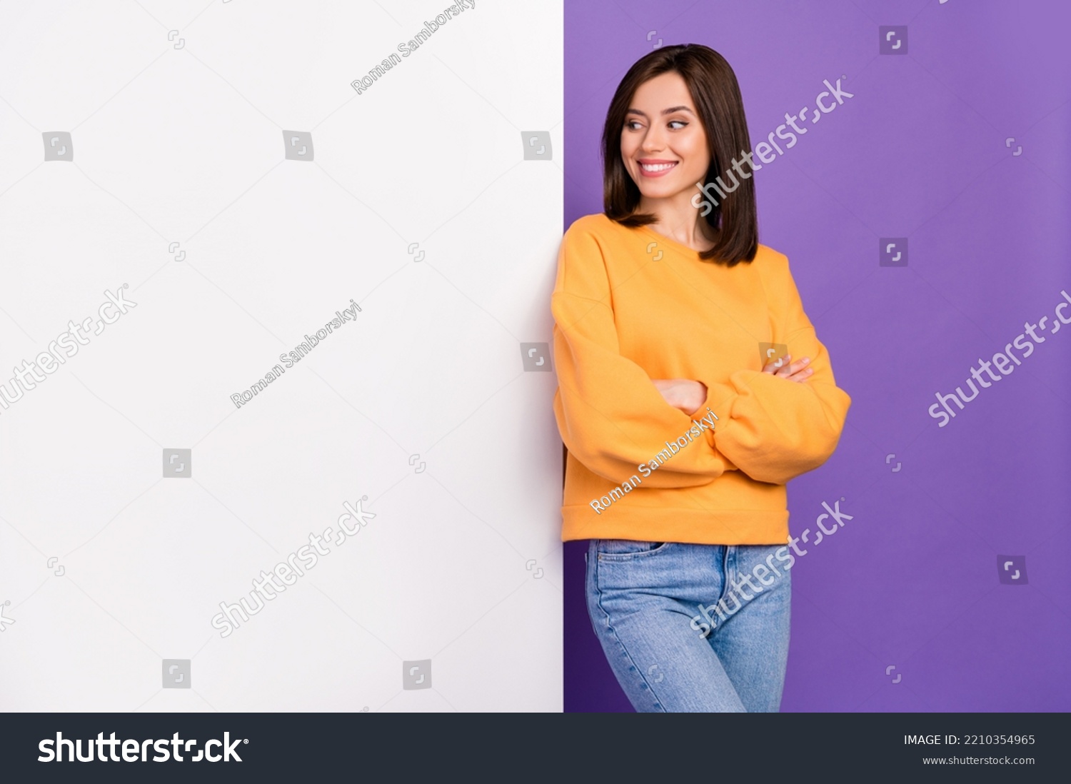Photo of positive dreamy lady dressed stylish autumn sweatshirt interested look big poster empty space isolated on purple color background #2210354965