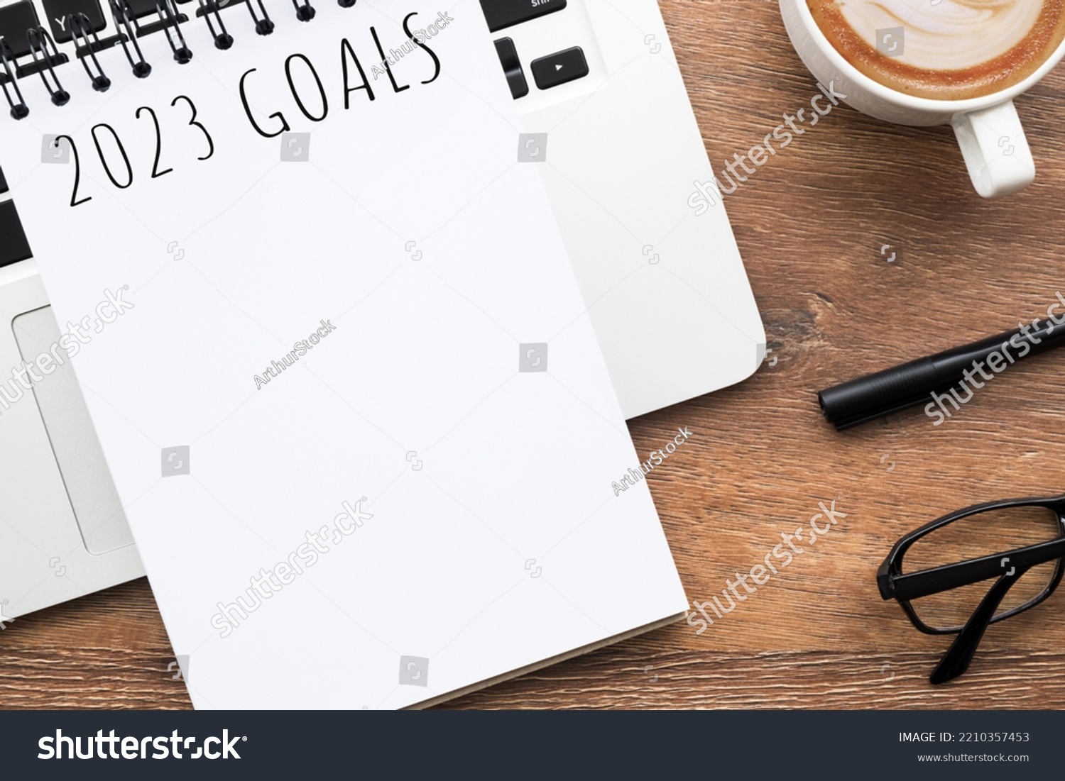 Notebook with 2023 goals text on it to apply new year resolutions and plan. #2210357453