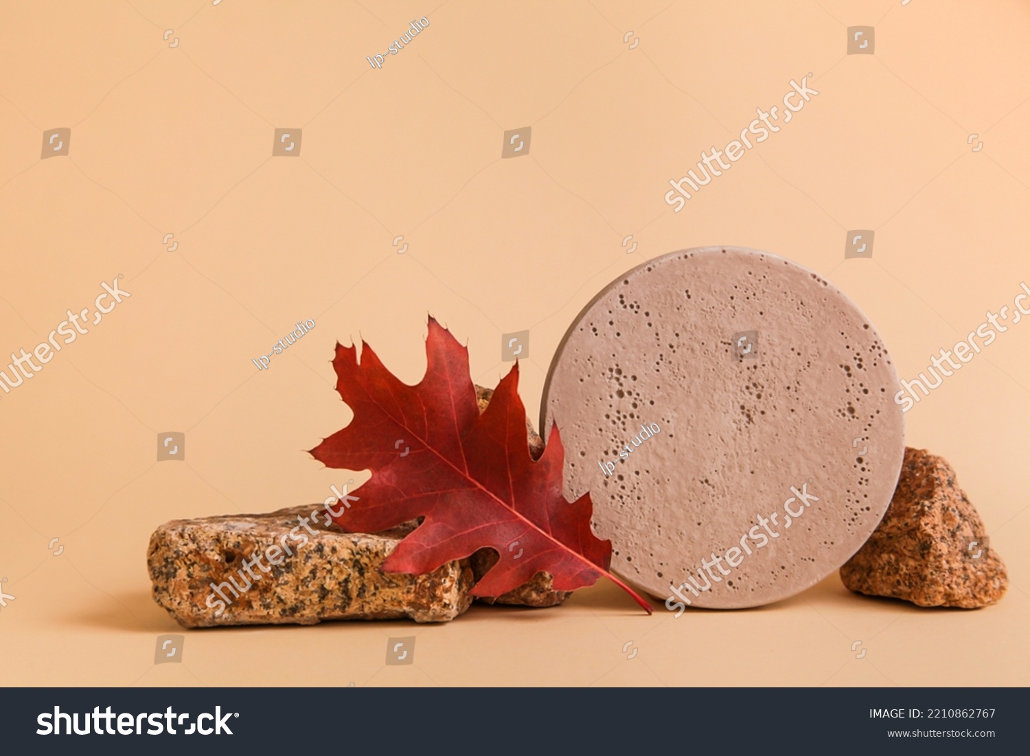 natural stone, decor and autumn leaves against beige background. Fall Seasonal Background #2210862767