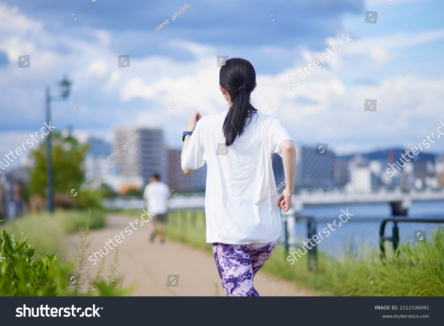 Young Japanese woman exercising outdoors #2212106091