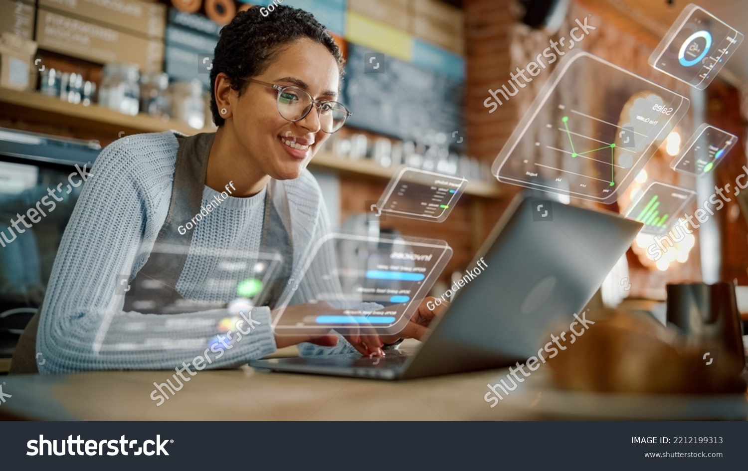 Beautiful Latina Coffee Shop Owner is Working on Laptop Computer and Checking Inventory in a Cozy Cafe. Restaurant Manager Browsing Internet and Chatting with Friends. VFX Augmented Reality Concept. #2212199313