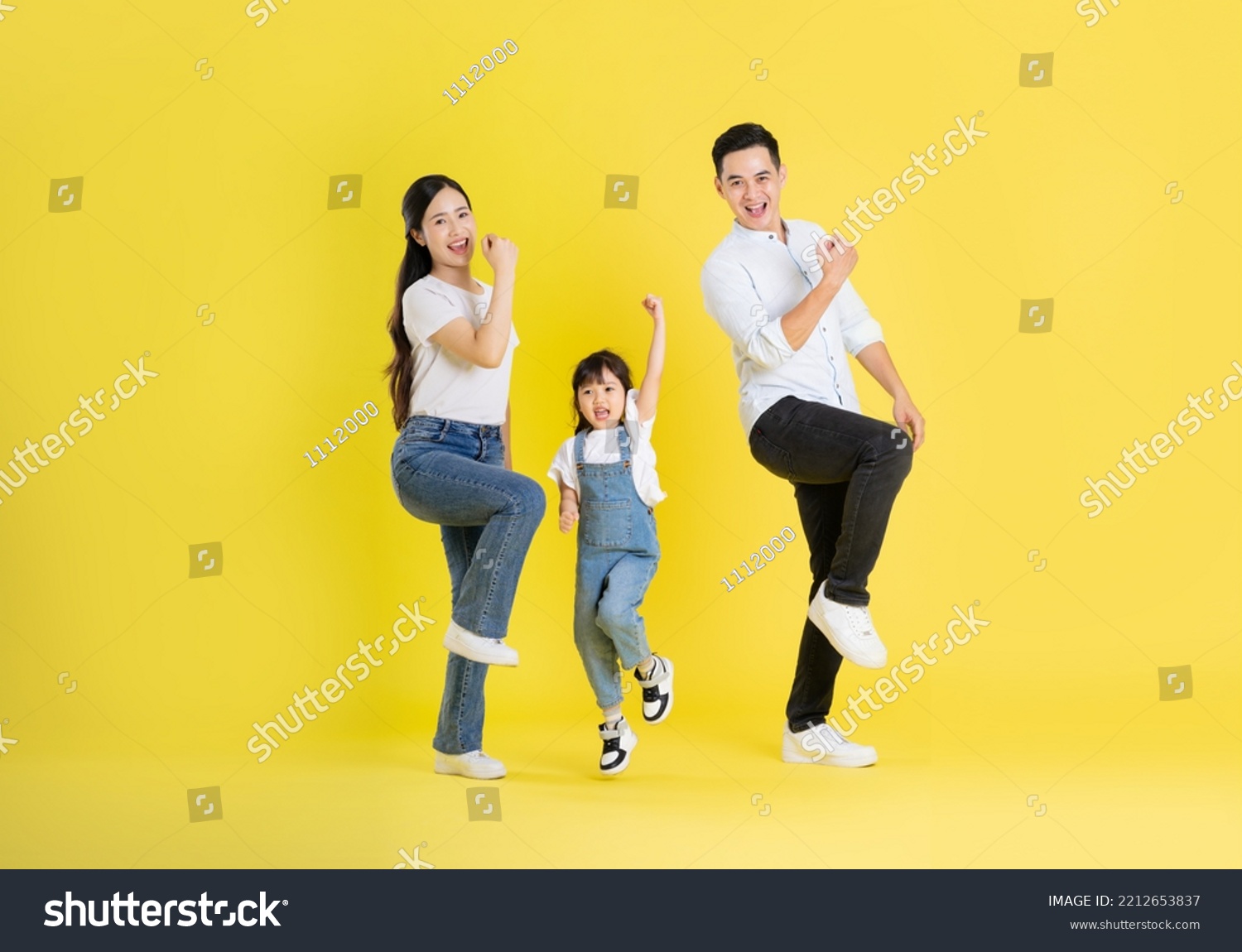 happy asian family image, isolated on yellow background #2212653837