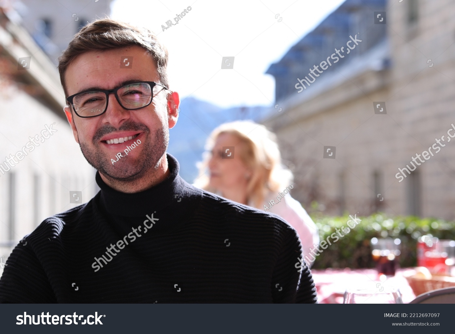 Elegant man wearing turtle neck sweater and classic eyeglasses  #2212697097