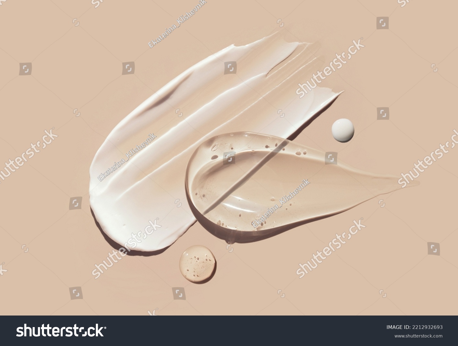 cosmetic smears of creamy texture on a pastel beige background #2212932693