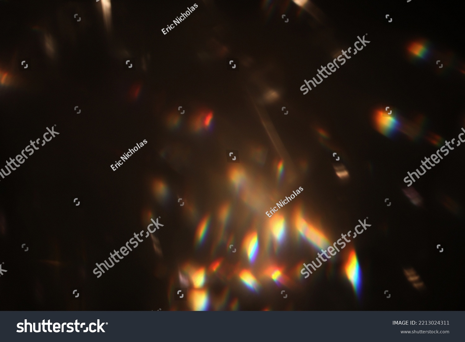 Abstract lens flare light over black background. Lens flare lights. Bokeh Prism Light Flares Overlay on Black Background. abstract Bokeh Lights. light leak. natural light effects. #2213024311