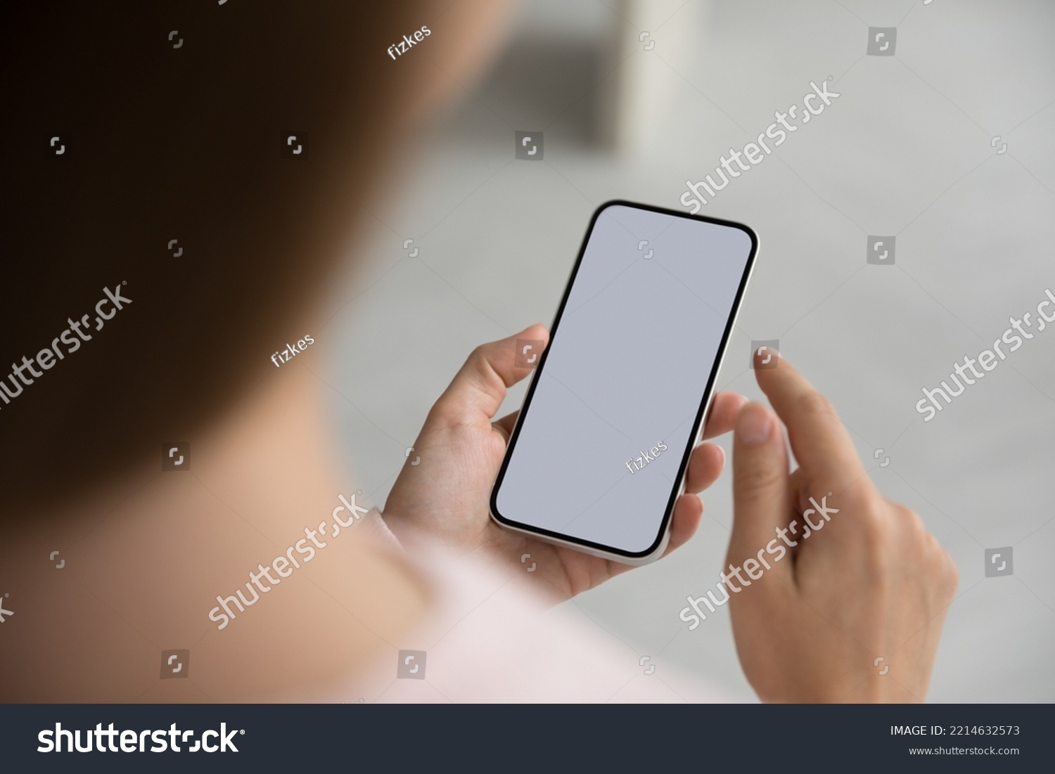Unknown woman holds mart phone with white blank mock up screen view, close up. Female using web site, makes call, order goods, enjoy remote comfort services, advertising new application or software #2214632573