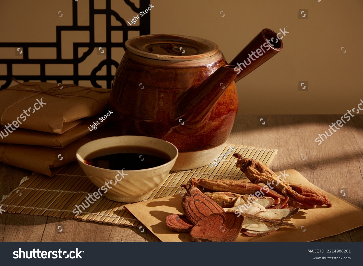 Tabletop herbal medicine vignette with Red Ginseng and finely cut dried mushrooms on the wooden table #2214988201