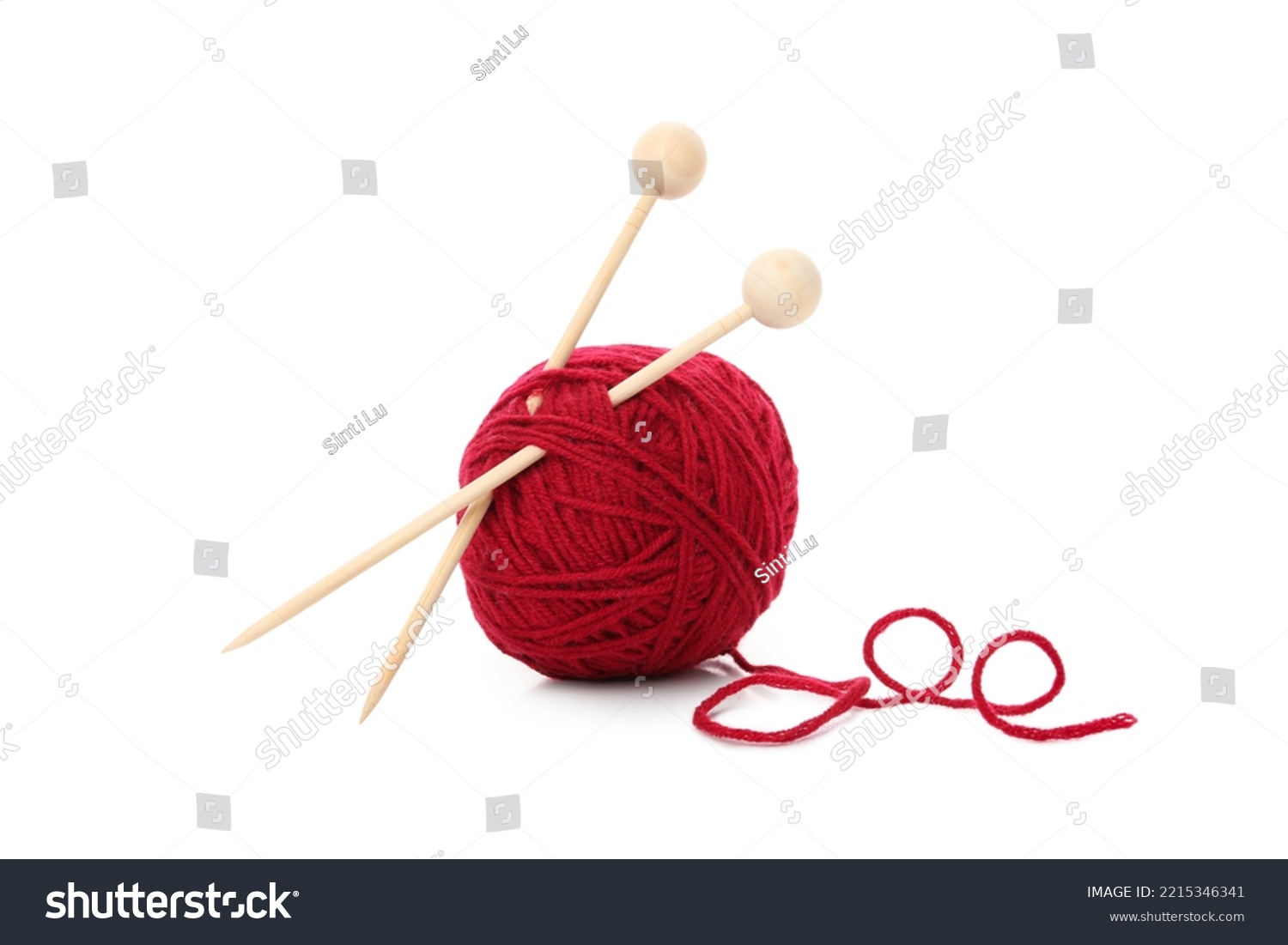 Red yarn ball with knitting needles, isolated on white background. #2215346341
