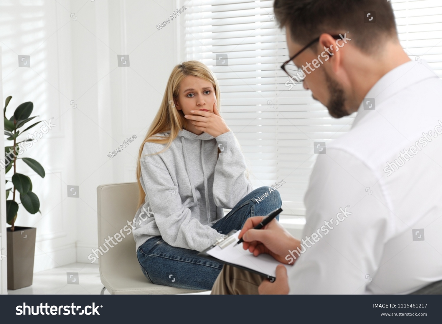 Psychotherapist working with drug addicted young woman indoors #2215461217