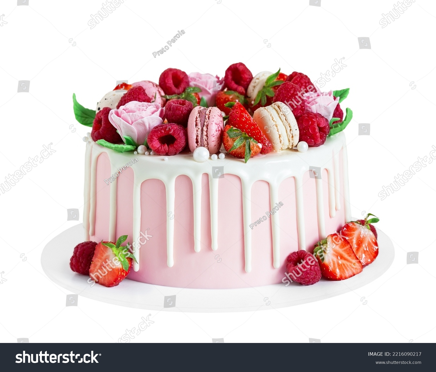 Birthday sweet cake with berries, macaron and floral decor isolated on a white background. Beautiful pink cake decorated with macarons, raspberries, strawberries and sugar rose flowers.  #2216090217