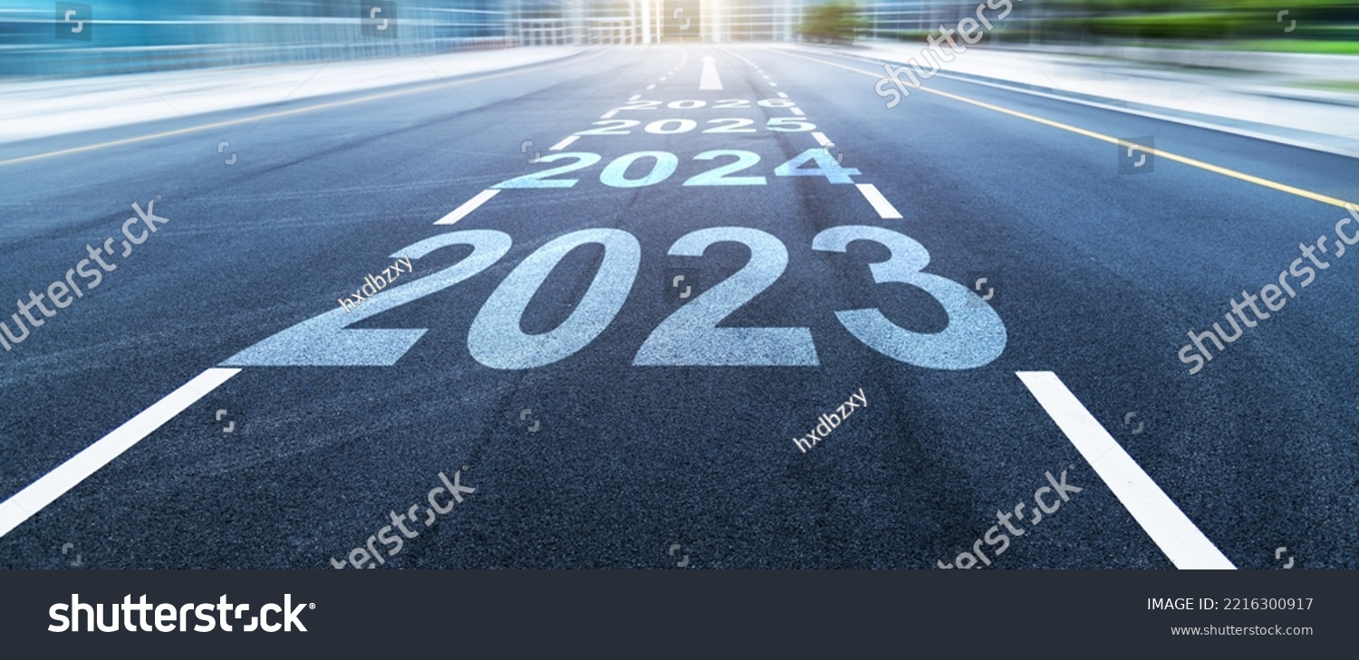 Black asphalt road with new year numbers 2023, 2024 to 2026 with white dividing lines #2216300917