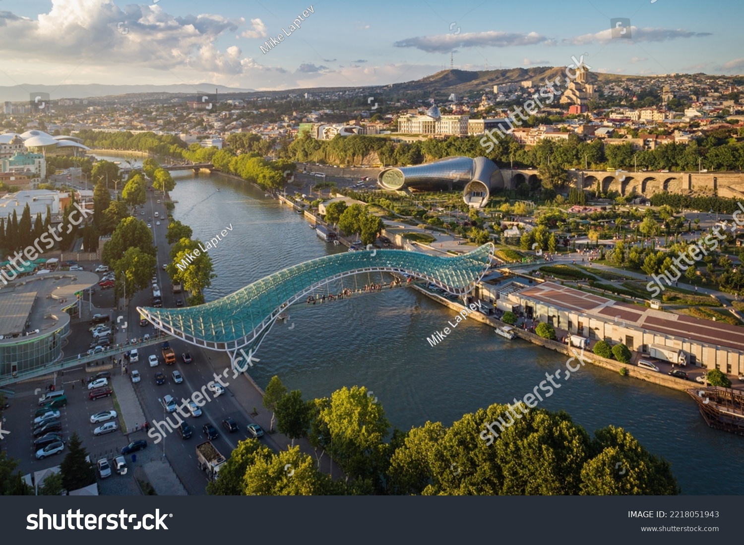 Panoramic aerial view of downtown Tbilisi, Georgia. In the foreground is the Peace Bridge over the Mtkvari River. #2218051943