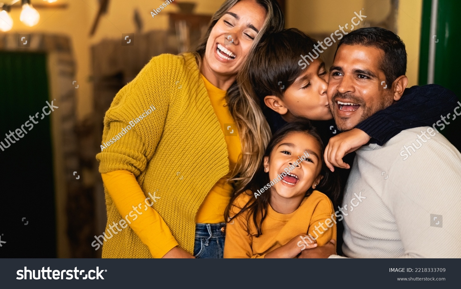 Happy Hispanic family having fun together #2218333709