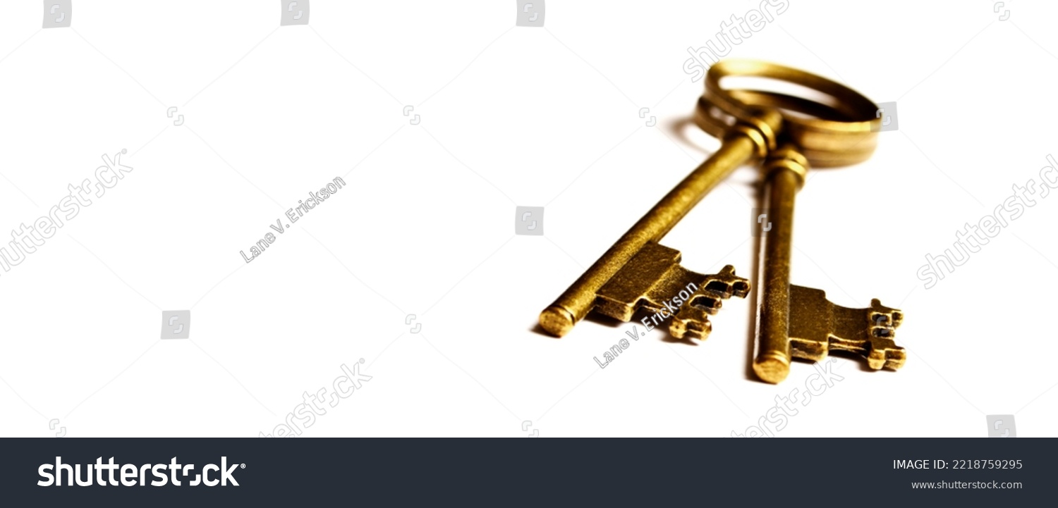 Old keys laying on top of white background isolated #2218759295
