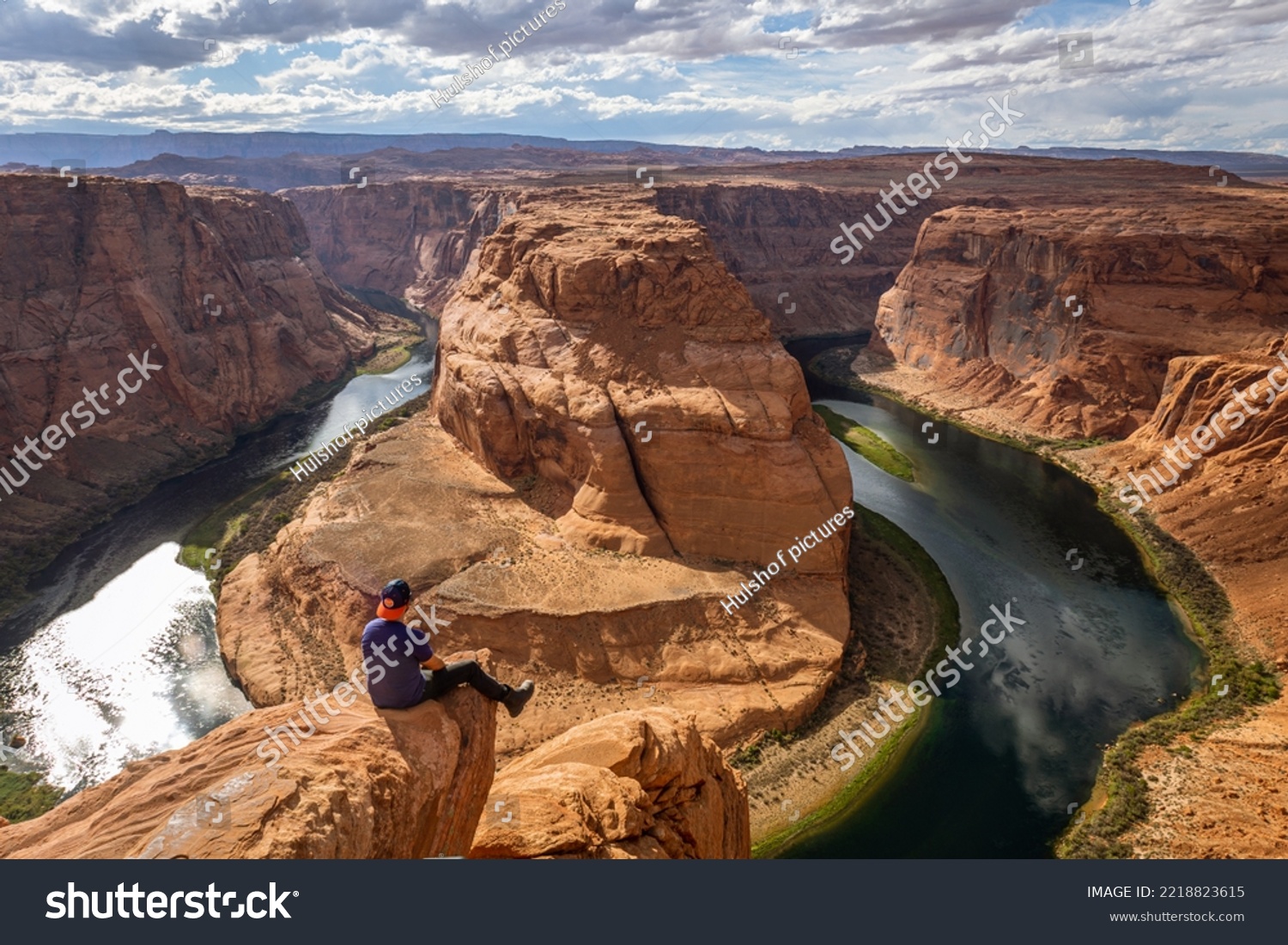 The famous horse shoe bend at Glen Canyon, with the Colorado River at the bottom surrounded by steep orange-red rocks, Arizona #2218823615