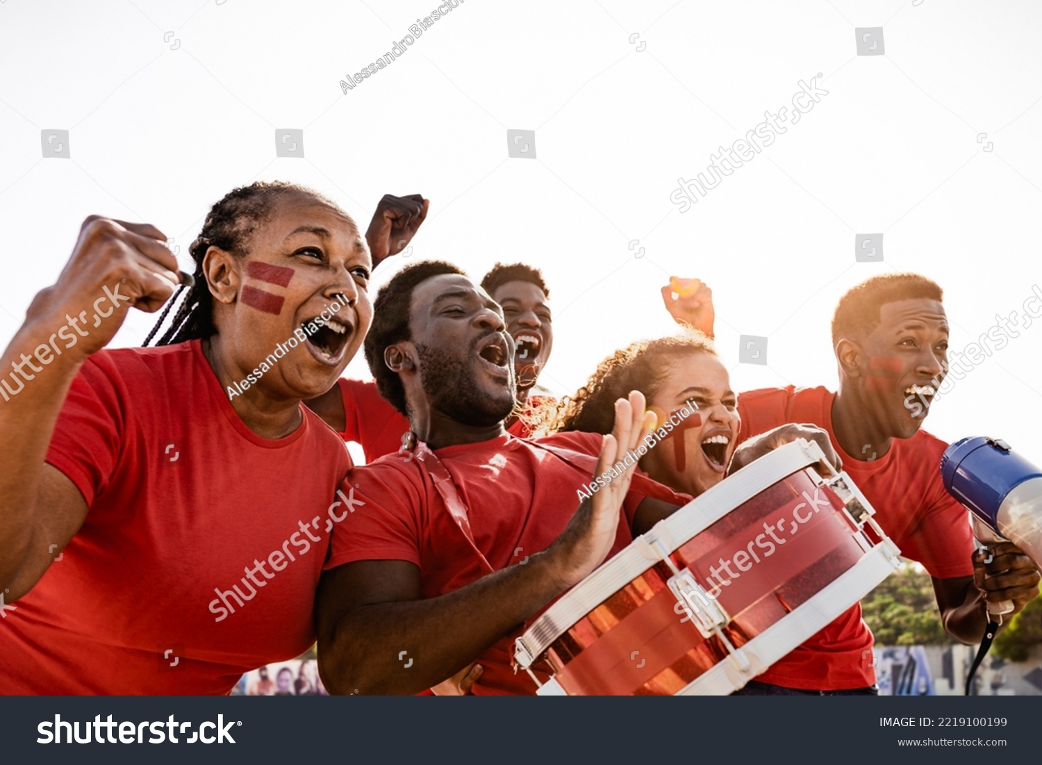 African football fans having fun cheering their favorite team - Soccer sport entertainment concept #2219100199