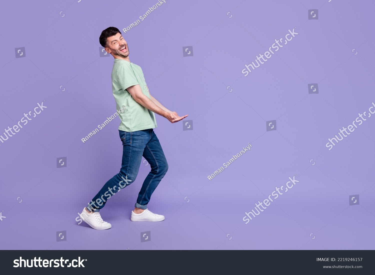 Full body photo of attractive man carry empty space invisible heavy box dressed stylish gray garment isolated on purple color background #2219246157