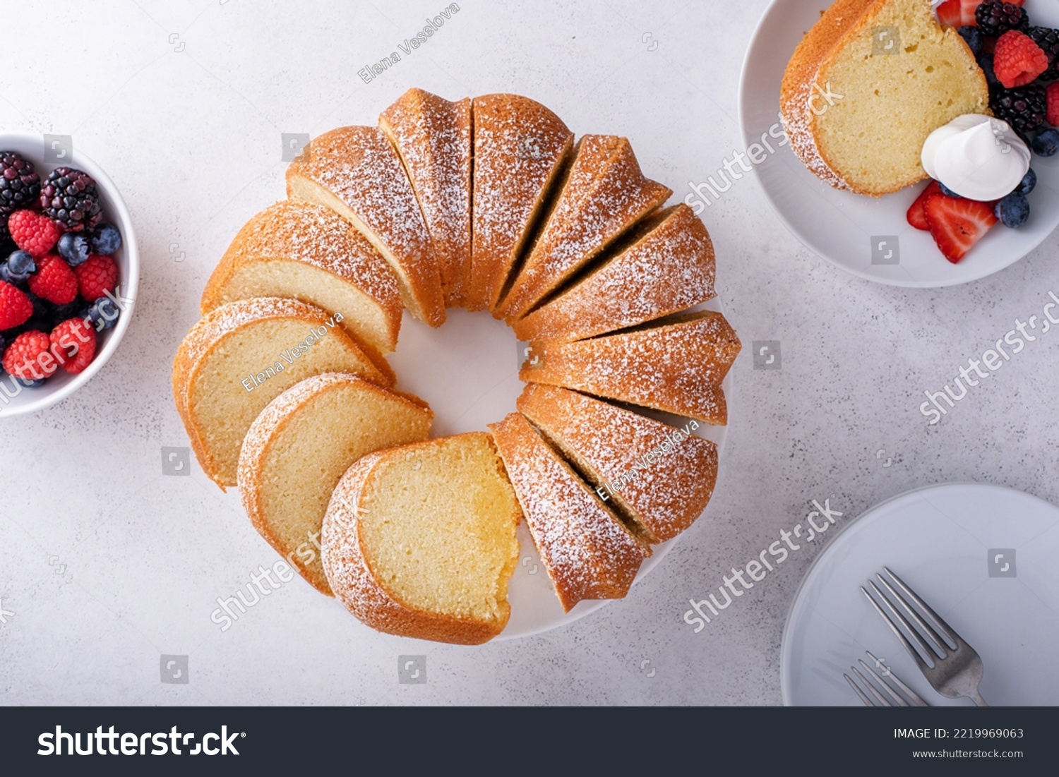 Pound cake baked in a bundt pan, traditional vanilla or sour cream flavor, dusted with powdered sugar #2219969063