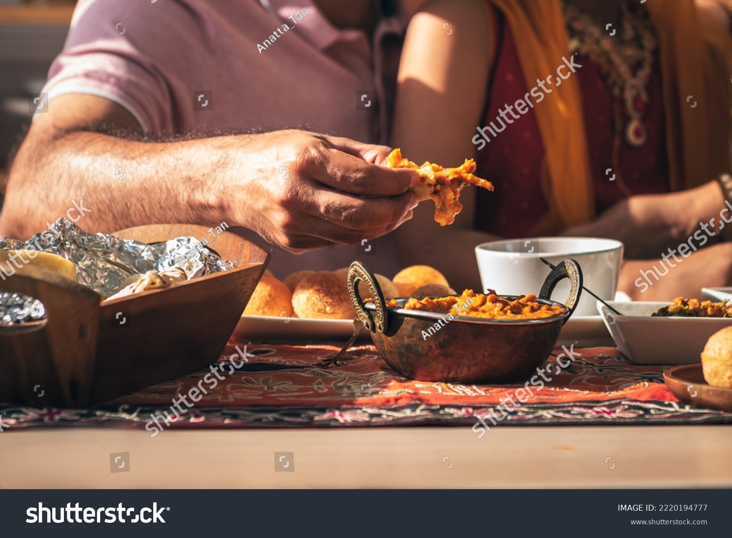 Close-up of Indian father's hand Picking up Indian food, which is to food culture of Indians, to Indian family and food concept. #2220194777