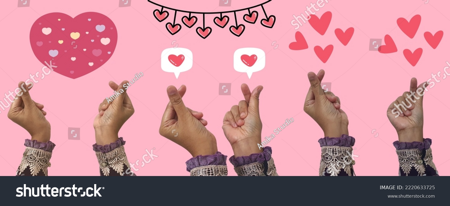 Heart in Hands Symbol, Love and Heart Sign Symbol on a Green Screen Background Represent a Korean Heart Sign Symbol. Korean Hand Love Sign #2220633725