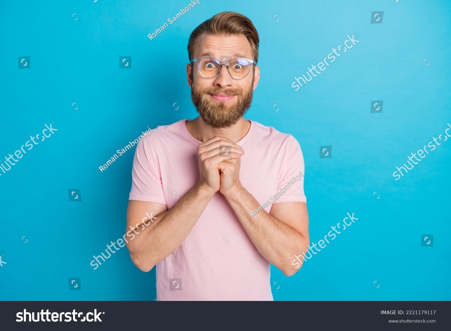 Photo portrait of attractive young guy eyeglasses adorable hands together dressed stylish pink look isolated on aquamarine color background #2221179117