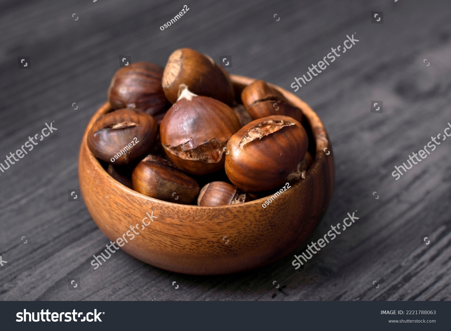 cooked chestnuts in wooden bowl and wooden background floor #2221788063