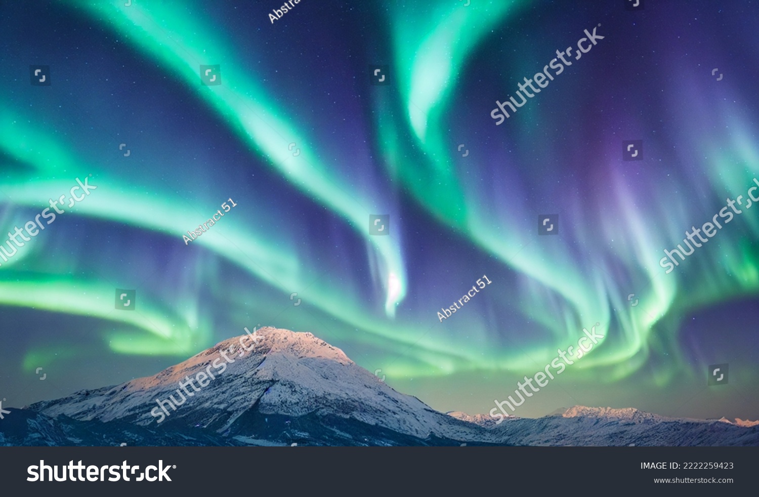 Northern Lights over snowy mountains. Aurora borealis with starry in the night sky. Fantastic Winter Epic Magical Landscape of snowy Mountains.   #2222259423