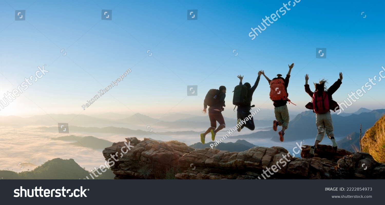 Group of happy hiker jumping on the hill. hiking holiday, wild adventure #2222854973