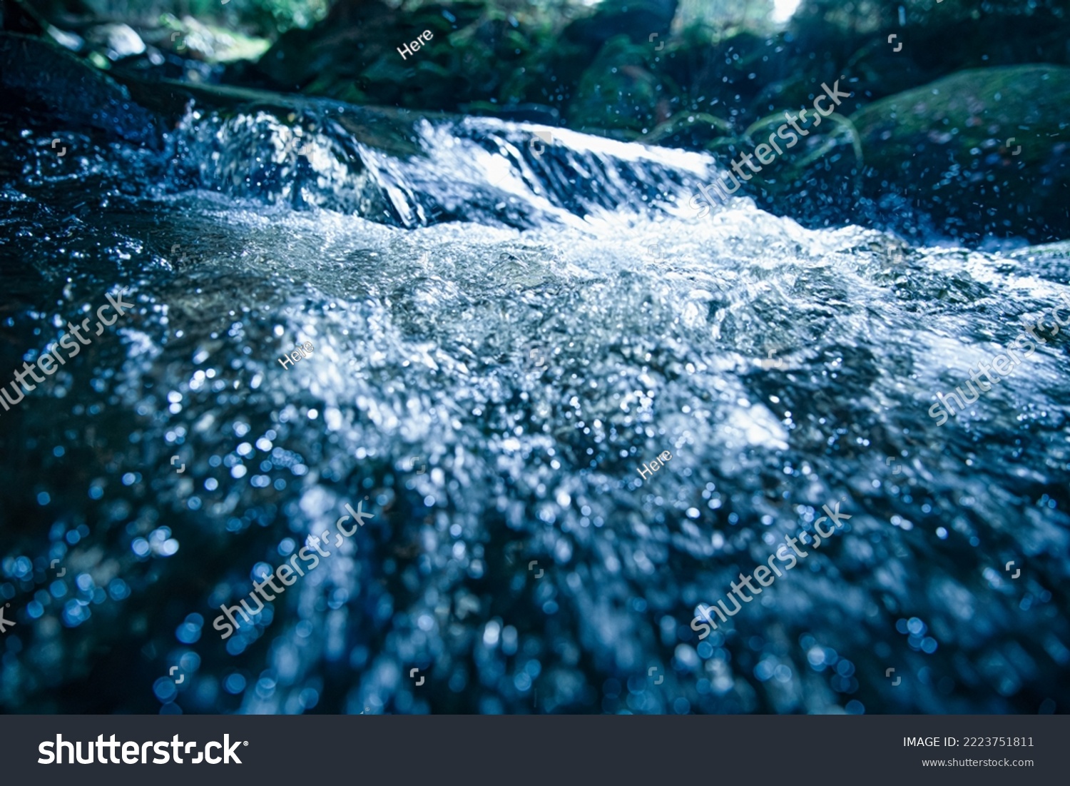 BLUBBLING WATER STREAM, FRESH BLUE BACKDROP, COLD WATER RIVER IN MOUNTAIN LANDSCAPE, NATURAL REFRESHING DESIGN #2223751811