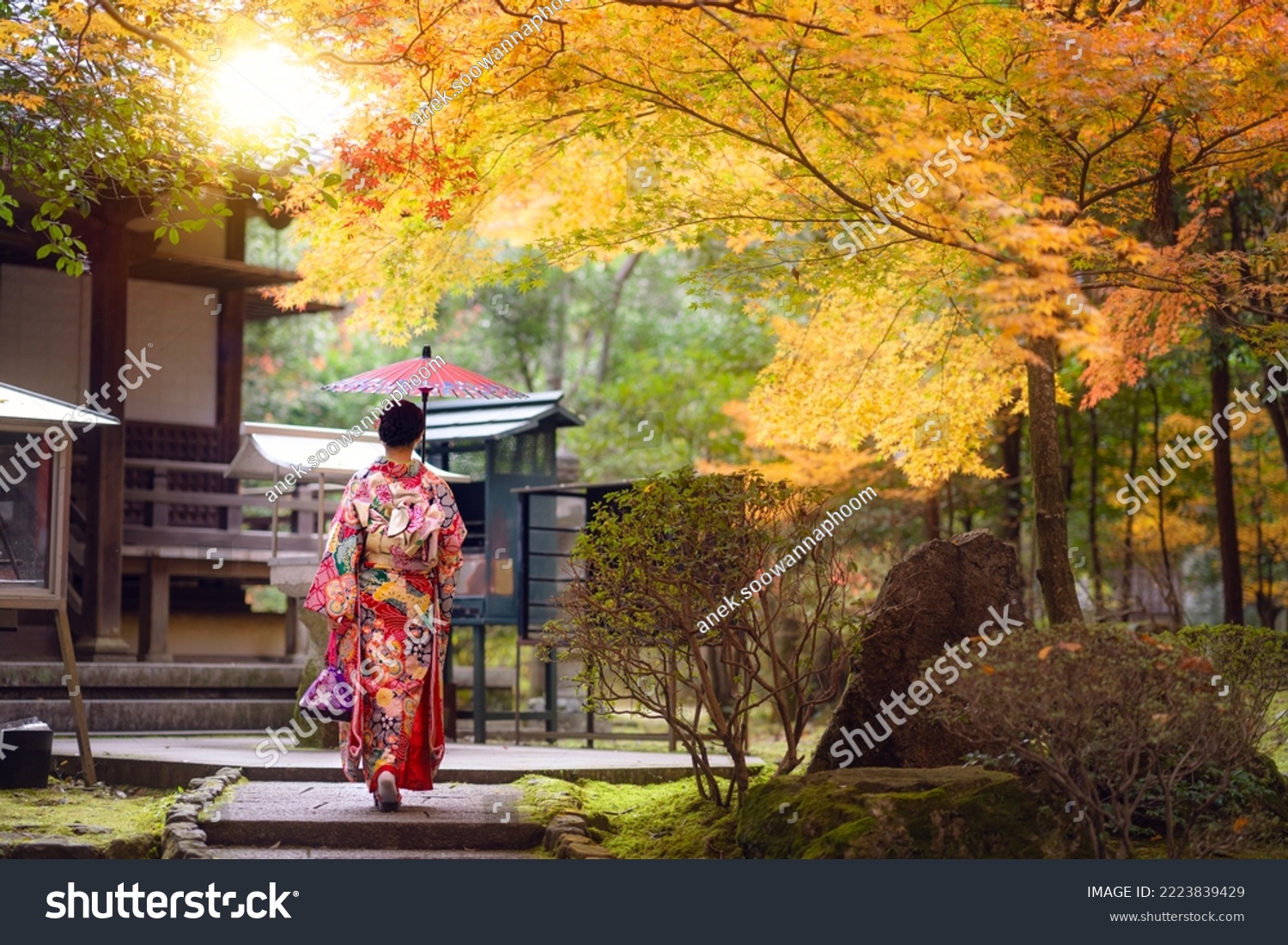 Asian traveler girl in Kimono traditional dress walking in old temple in Autumn season in Kyoto city, Japan #2223839429