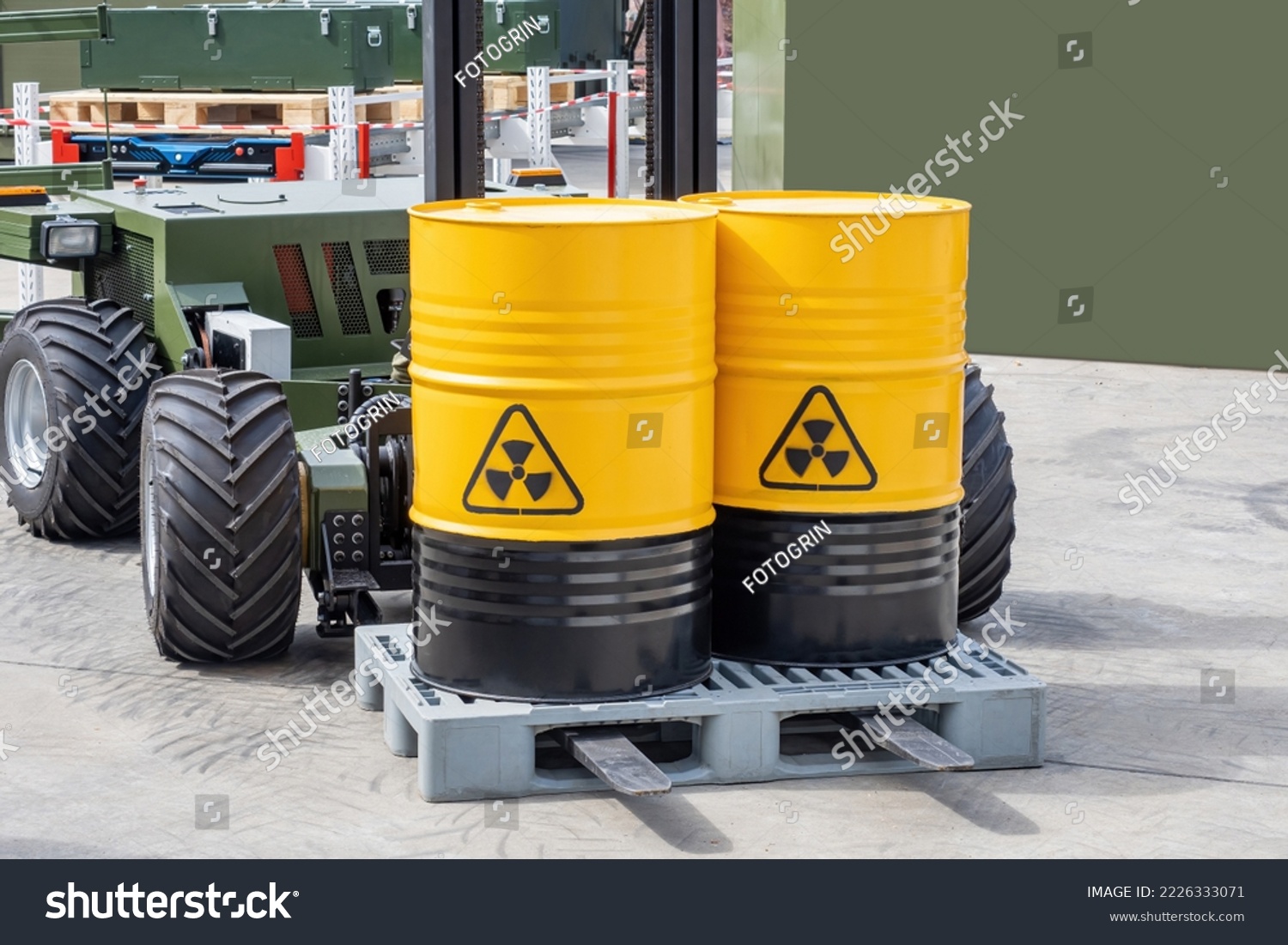Barrels with radioactive products. Unmanned forklift. Machine for working in radioactive zone. Forklift for transportation of hazardous substances. Robot carries barrels of radioactive material #2226333071