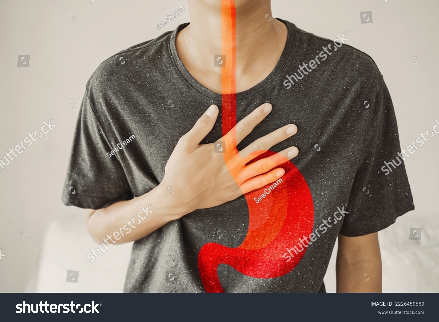 Young man having  heartburn, Gastroesophageal reflux disease (GERD) or acid reflux symptom, health care concept #2226459569