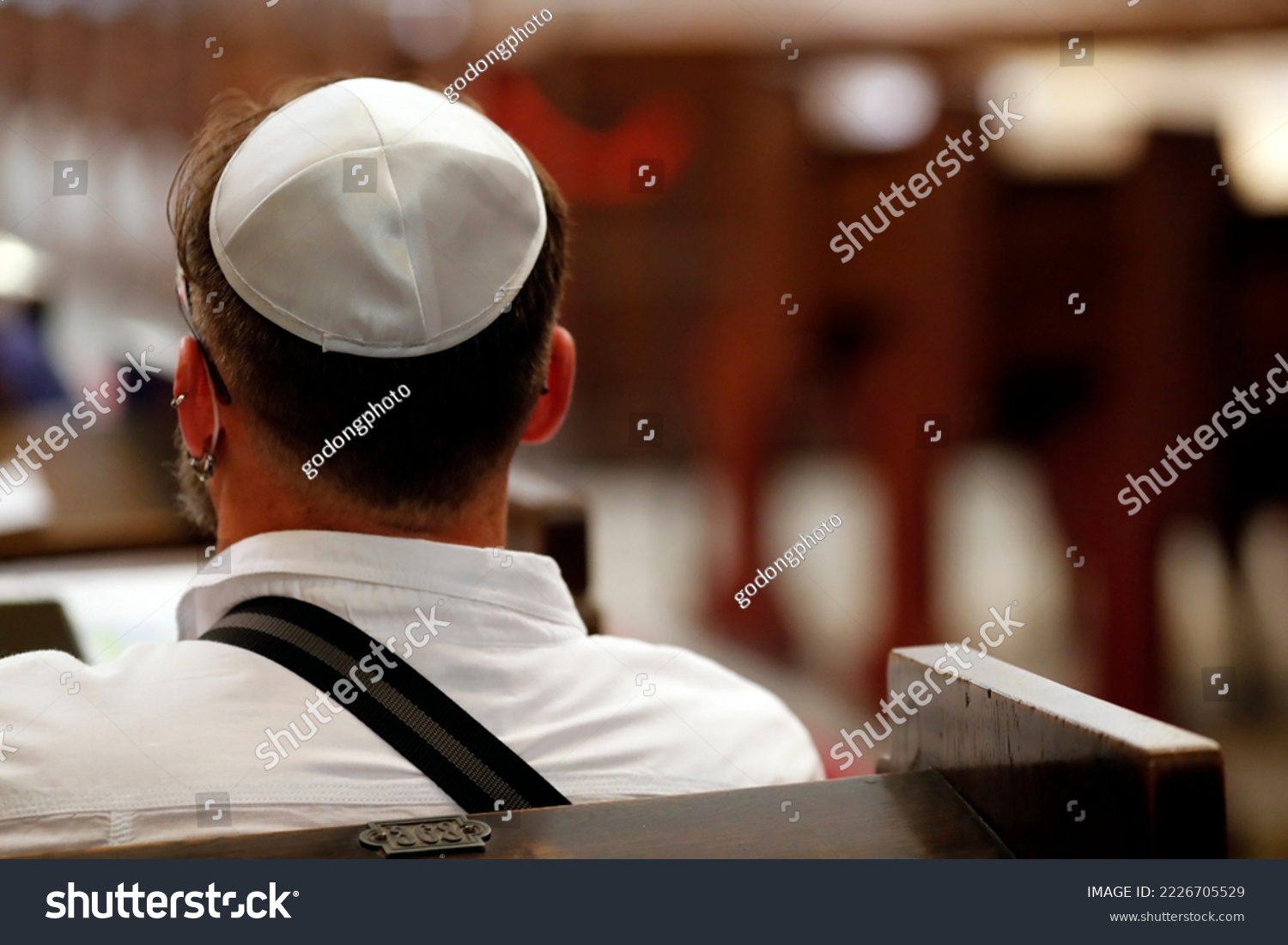 Jewish man wearing a kippah in a synagogue.  Trieste. Italy.  #2226705529