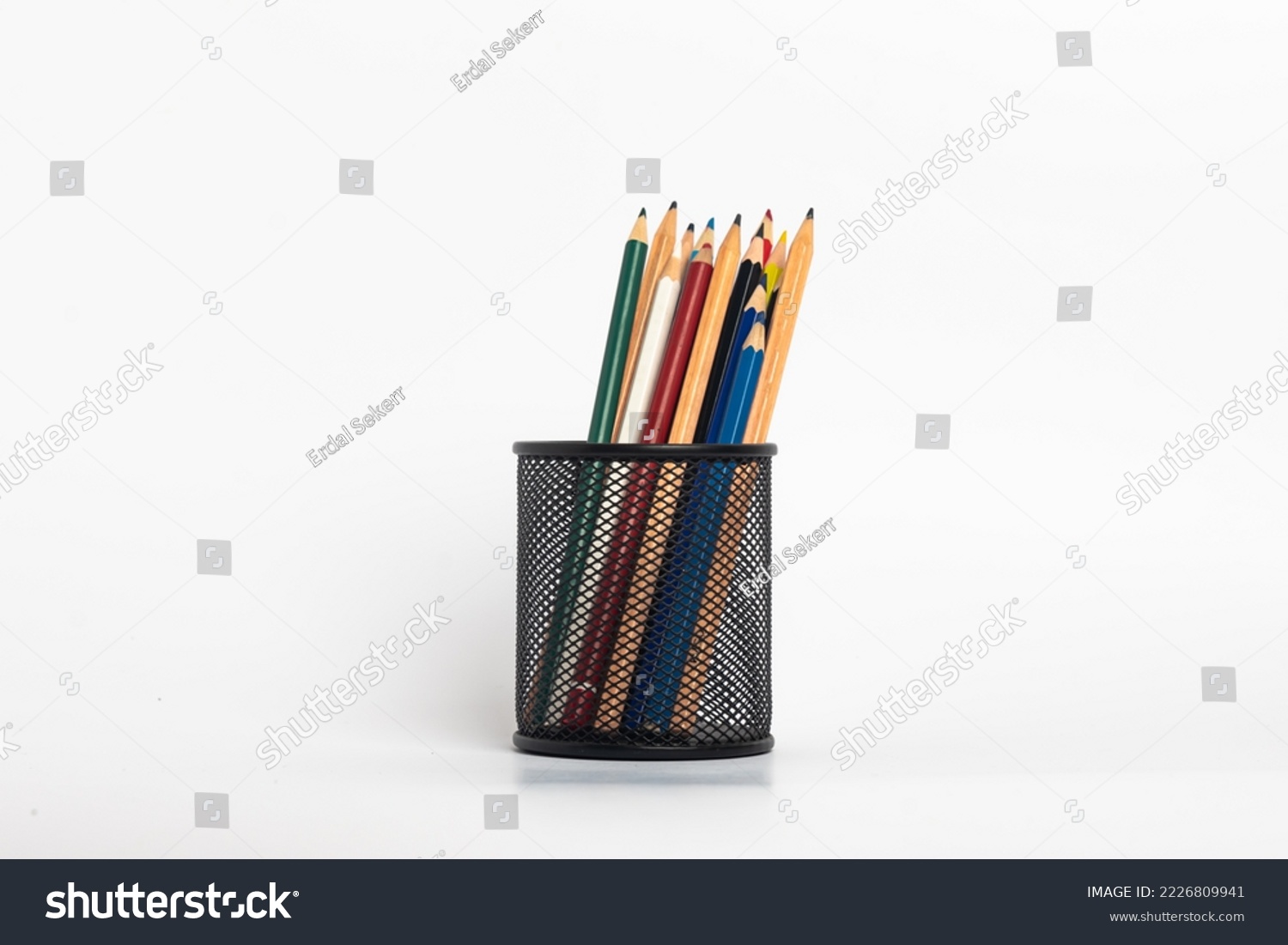 black pen holder full of colored pencils isolated on white background , Education consept idea #2226809941