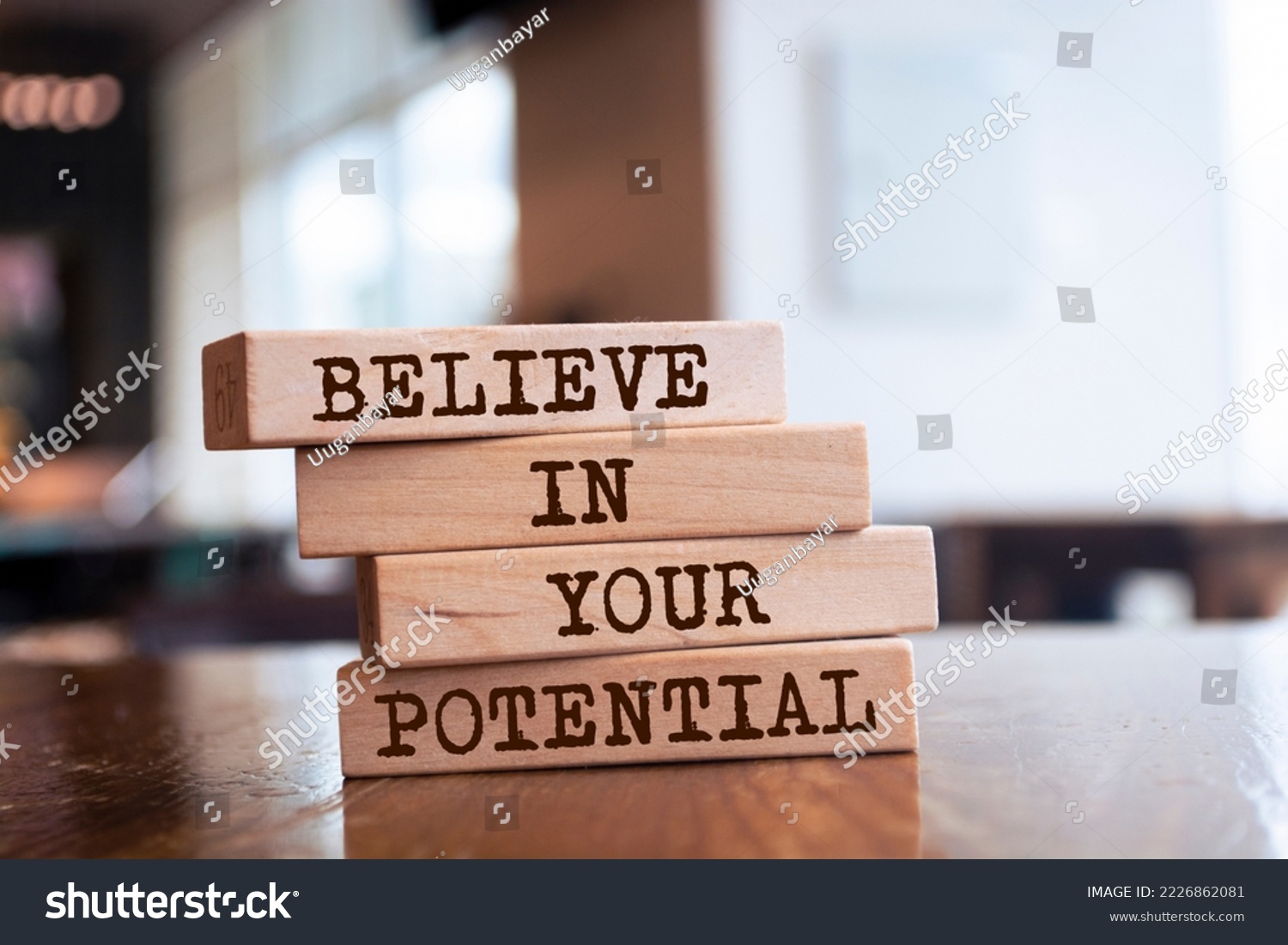 Wooden blocks with words 'Believe in your potential'. #2226862081