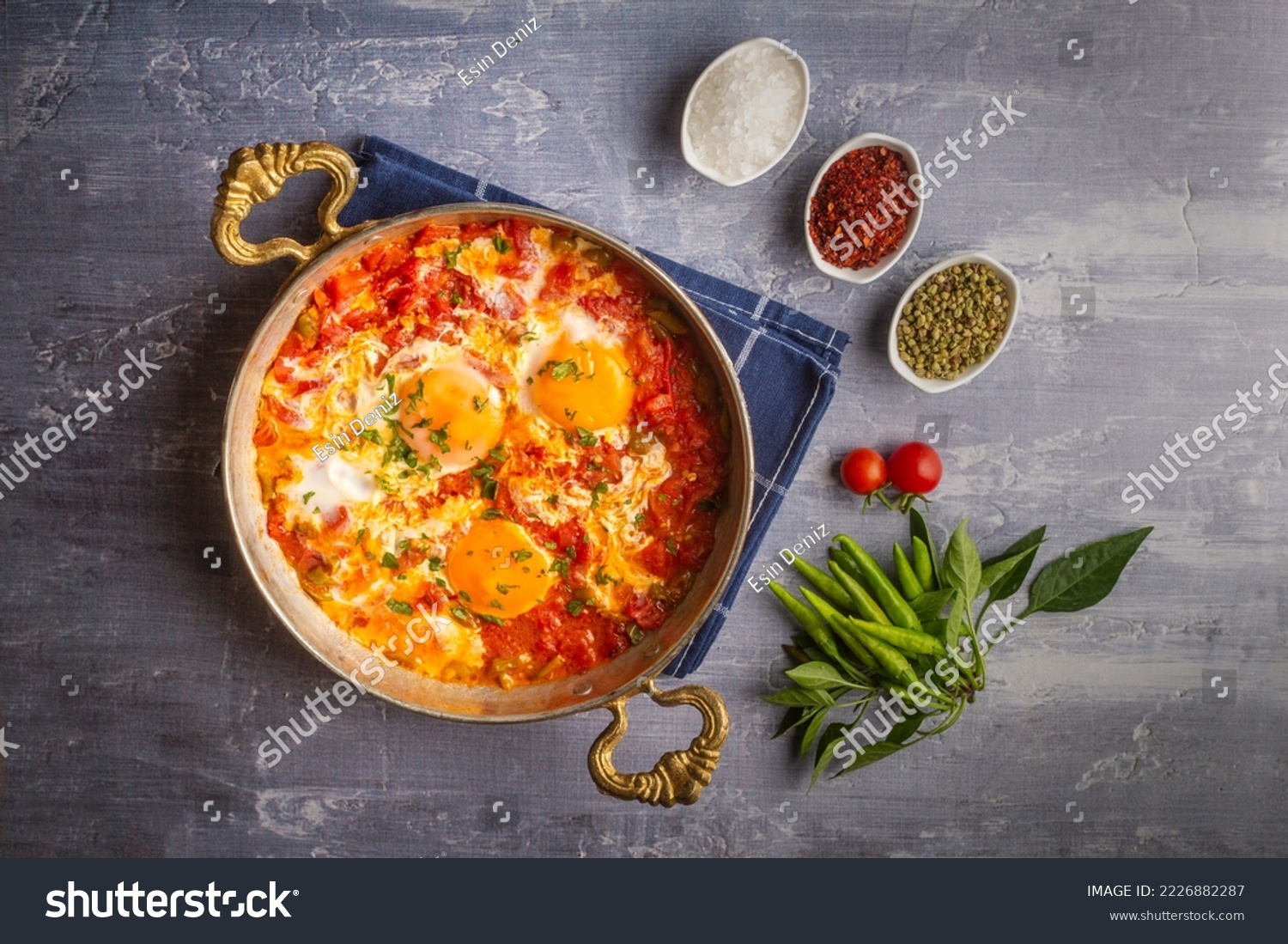 Famous Turkish menemen dinner on table, made by eggs, pepper and tomatoes. #2226882287