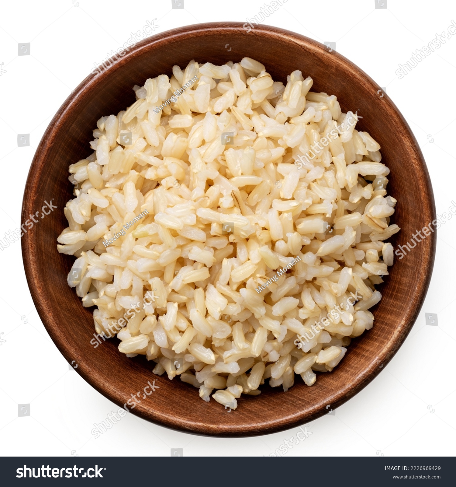 Brown cooked rice in a brown wood bowl isolated on white. Top view. #2226969429